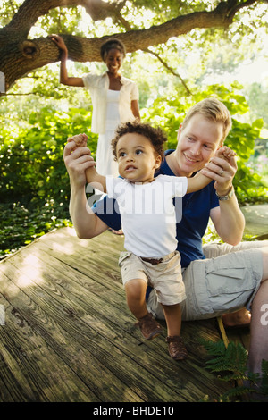 Multi-ethnic family enjoying garden Stock Photo