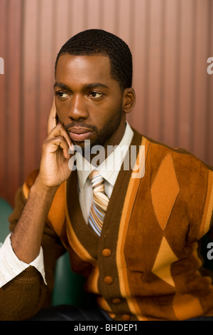 Well-dressed African man looking pensive Stock Photo