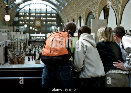 Paris, France - Group Tourist Family, Teens, People From Behind, on Holiday Looking over Balcony Visiting Inside of Orsay Museum, 'Musée d’Orsay' teenagers visit museum Stock Photo