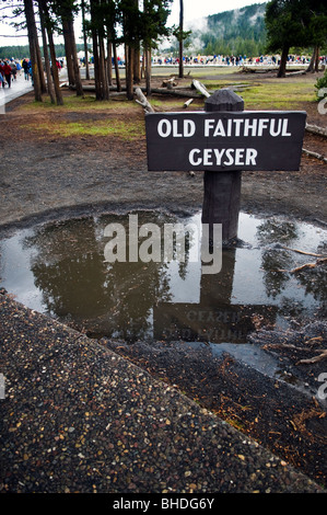 Yellowstone National Park, The sign on the foot path for Old Faithful Geyser, right after a summer downpour. Stock Photo