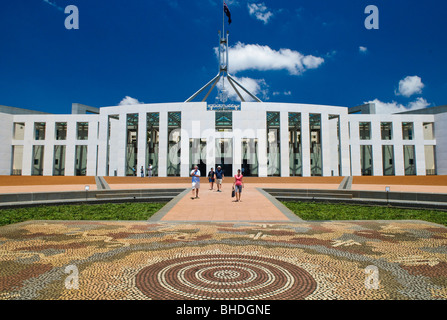 CANBERRA, Australia - The front of Parliament House, featuring an aboriginal tiled design on the ground. Parliament House is the meeting place of the Parliament of Australia. It is located in Canberra, the capital of Australia. It was opened on 9 May 1988 by Queen Elizabeth II, Queen of Australia.[1] Its construction cost was over $1.1 billion. At the time of its construction it was the most expensive building in the Southern Hemisphere. Prior to 1988, the Parliament of Australia met in the Provisional Parliament House, which is now known as 'Old Parliament House'. Stock Photo