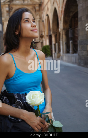 Thai woman holding white rose Stock Photo