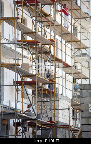 Workers installing thermal insulation on a building, Poznan, Poland Stock Photo