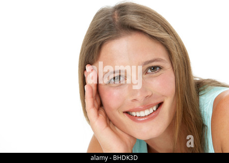 Studio Portrait Of Smiling Young Woman Stock Photo