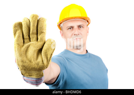 Blue collar worker making a stop sign, isolated on white background Stock Photo