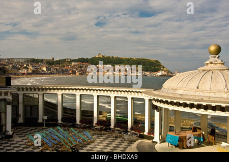 Domed roof of the Spa bandstand, with black and white tiled floor of the sun court in the foreground and South Bay beach in the distance. Scarborough. Stock Photo