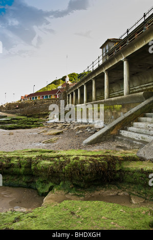 Beach and brightly painted beach huts at South Bay, Scarborough Stock Photo