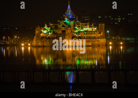 Karaweik restaurant at night, Kandawgyi Lake; Rangoon, Yangon; Burma, Myanmar Stock Photo