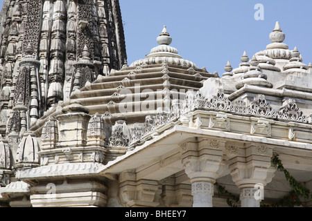 The smaller Jain temple of the sun at Ranakpur.  Intricately-carved white stone with multiple domes and cupolas adorn the temple Stock Photo