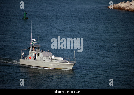 Mexican Navy patrol boat that escorted a cruise ship out of port in Puerto Vallarta. Armed ship used to protect ships Stock Photo