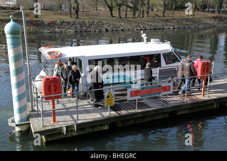 people disembarking from the water bus at the cardiff castle stop on the river taff  cardiff wales uk Stock Photo