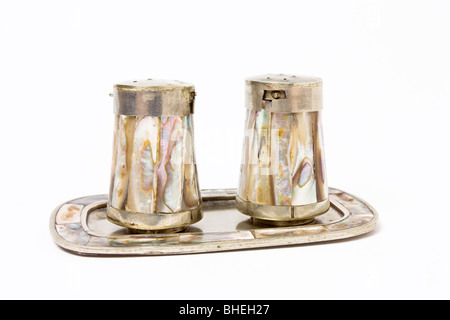 Silver and mother of pearl salt and pepper cruet set. Stock Photo