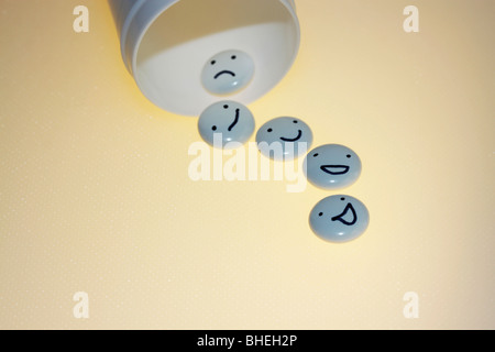 White tablets with mood faces on light  background. Stock Photo