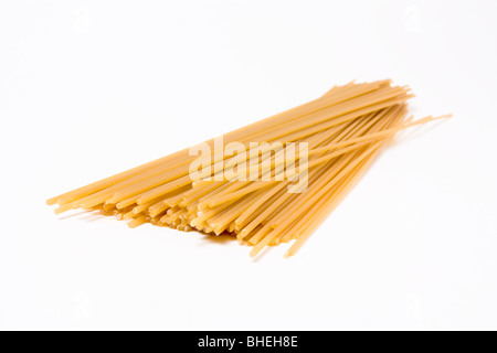 Dried spaghetti isolated against white background. Stock Photo