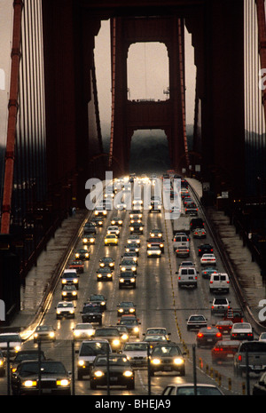 Rush hour traffic going over golden gate bridge on dull wet evening, San Francisco, California, America, USA Stock Photo