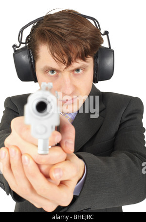 Businessman aiming a gun, isolated on a white background Stock Photo