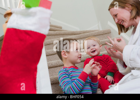 Woman signing the word 'Family' in American Sign Language while communicating with her son Stock Photo