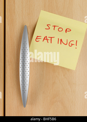 Stop Note on Cupboard Stock Photo - Alamy