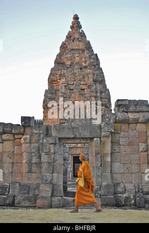 Monk walking past Prang, Prasat Hin Khao Phanom Rung, Khmer Temple in Buriram province, Thailand, Asia Stock Photo