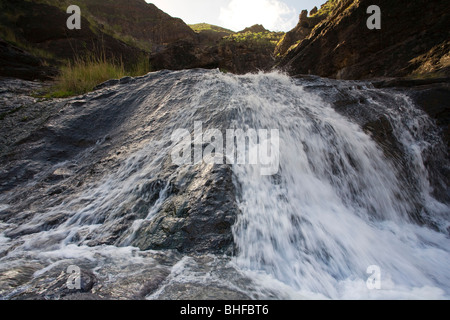 Waterfall in the mountains, Barranco del Charco Azul, Valley of El Risco, Parque Natural de Tamadaba, Gran Canaria, Canary Islan Stock Photo