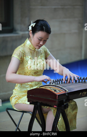 Kuzhan Chinese musician girl China town Asia show performance celebration celebrations China motion traditional travel colourful Stock Photo