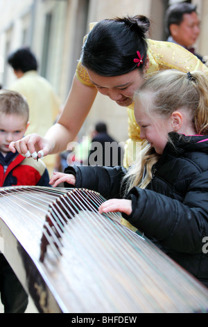 Kuzhan Chinese musician girl China town Asia show performance celebration celebrations China motion traditional travel colourful Stock Photo