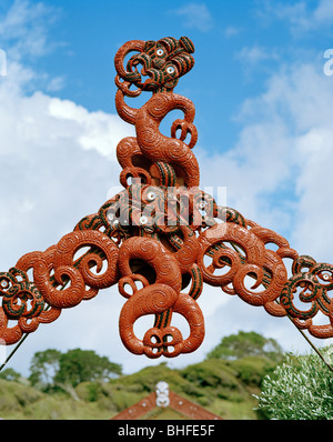 Traditional Maori wood carvings at the entrance of Marae Papatea, North coast, Eastcape, North Island, New Zealand Stock Photo