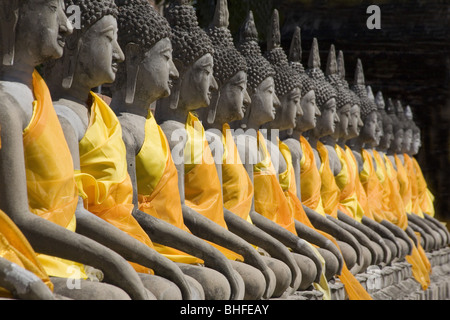 Buddha statues wearing monks' robes in a row, Wat Yai Chai Mongkhon, Ayutthaya, Province Ayutthaya, Thailand, Asia Stock Photo