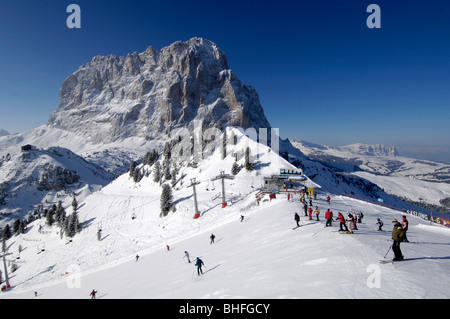 Skiers on a ski slope near the summit station, Mountain landscape in Winter, Sella Ronda, Gherdeina, Val Gardena, South Tyrol, I Stock Photo