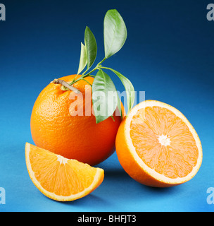 Ripe orange on a blue background Stock Photo
