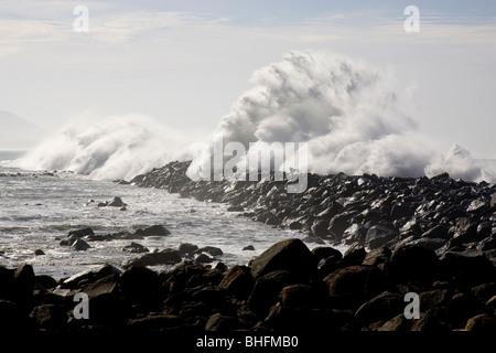 Large Wave Crashing over Breakwater Stock Photo