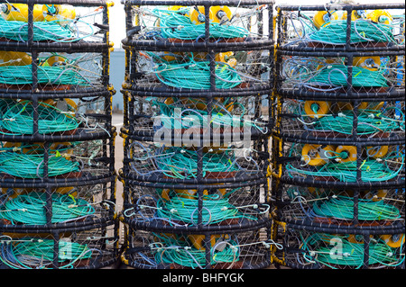 Stack of crab traps and colorful buoys. Stock Photo
