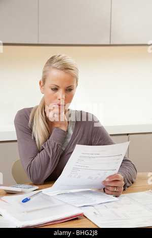 Young woman doing home finances Stock Photo