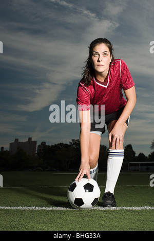 Football player with ball Stock Photo