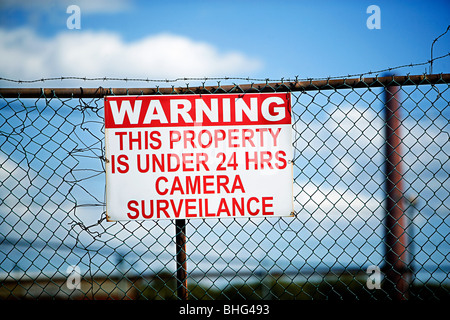 Warning sign on fence Stock Photo