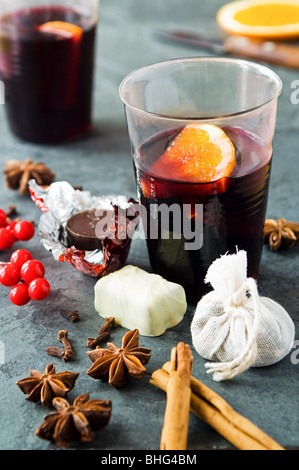 Mulled wine with spices and chocolates Stock Photo