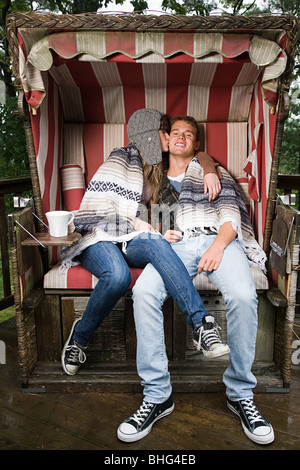 Young couple on beach chair Stock Photo