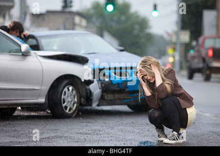 Young woman involved in road accident Stock Photo