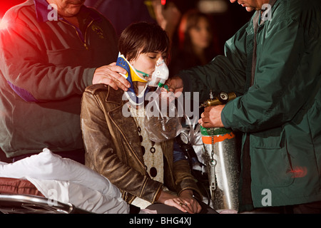 Young woman receiving medical attention Stock Photo