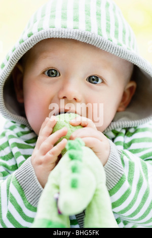 baby with dino-toy Stock Photo