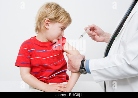 Boy getting immunization Stock Photo