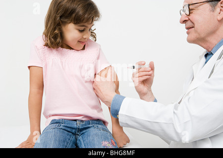 Girl getting immunization Stock Photo