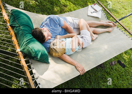 Couple lying in hammock Stock Photo