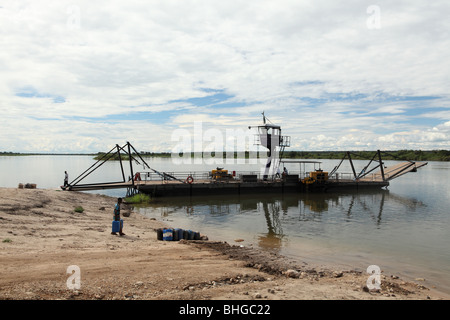 A pontoon ferry waits to take people across the Zambezi River at the border crossing of Kazangula between Botswana and Zambia Stock Photo