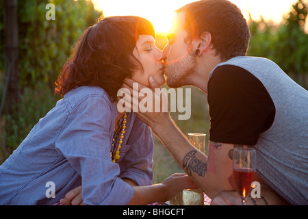Couple kissing at sunset Stock Photo