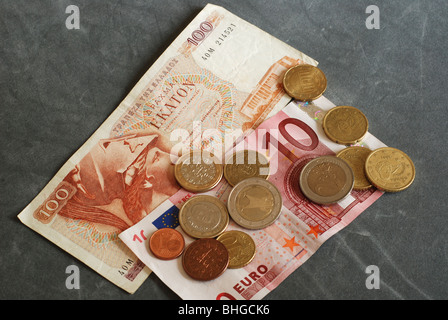 Greek 100 drachma note with ten euro note and coins Stock Photo