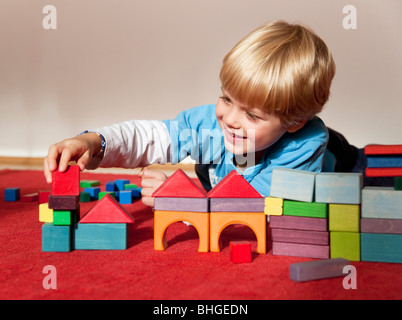 boy with toy building blocks Stock Photo