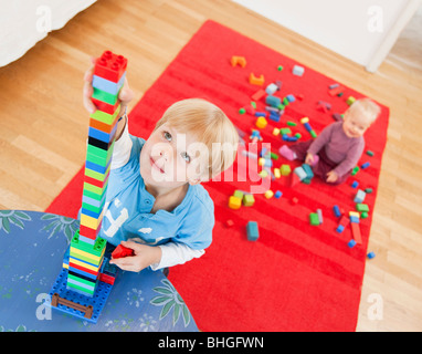 boy and baby with toy building blocks Stock Photo