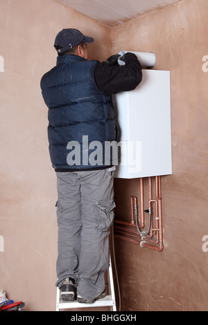 Installation of a new Vaillant ecotech 637 condensing boiler. Stock Photo