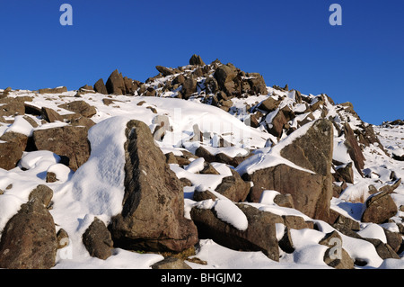 Outcrops of Spotted Dolerite - Bluestones on Carn Menynin snow Preseli Hills Pembrokeshire Wales Cymru UK GB Stock Photo